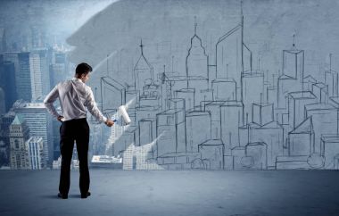 Zarif satıcı şehri duvarda yeniden boyuyor.