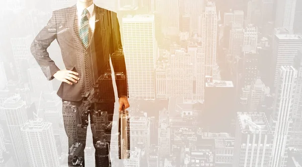 Business person with warm color overlay of city background — Stock Photo, Image