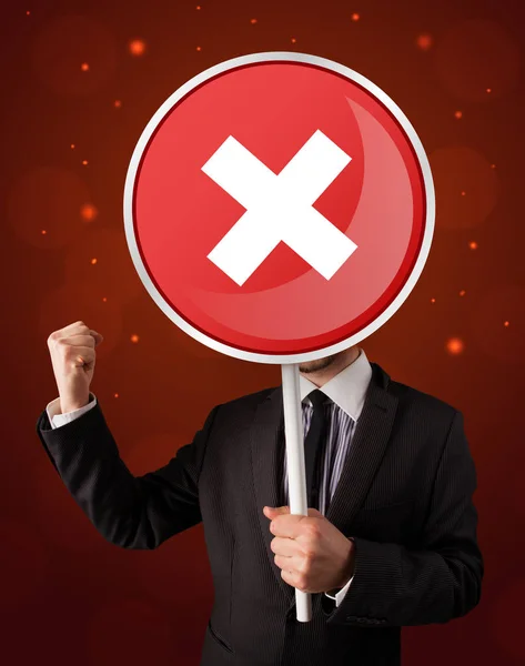 Businessman holding x sign — Stock Photo, Image