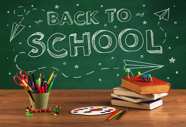 Back to school blackboard and student desk — Stock Photo, Image