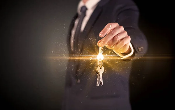 Man hand over keys — Stock Photo, Image