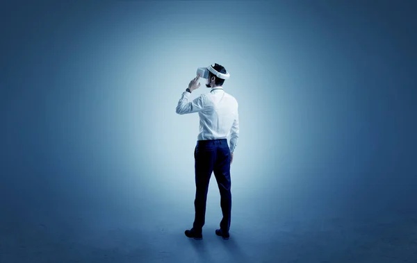 Businessman in an empty room with vr glasses — Stock Photo, Image