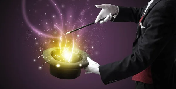 Magician hand conjure miracle from cylinder — Stock Photo, Image