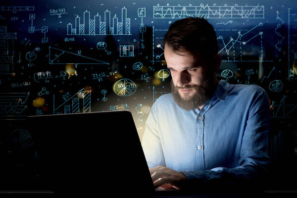 Businessman in the office at night