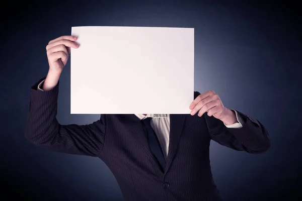 Businessman holding blank paper — Stock Photo, Image