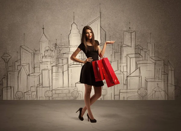 Winkelen meisje met tassen in getrokken stad — Stockfoto