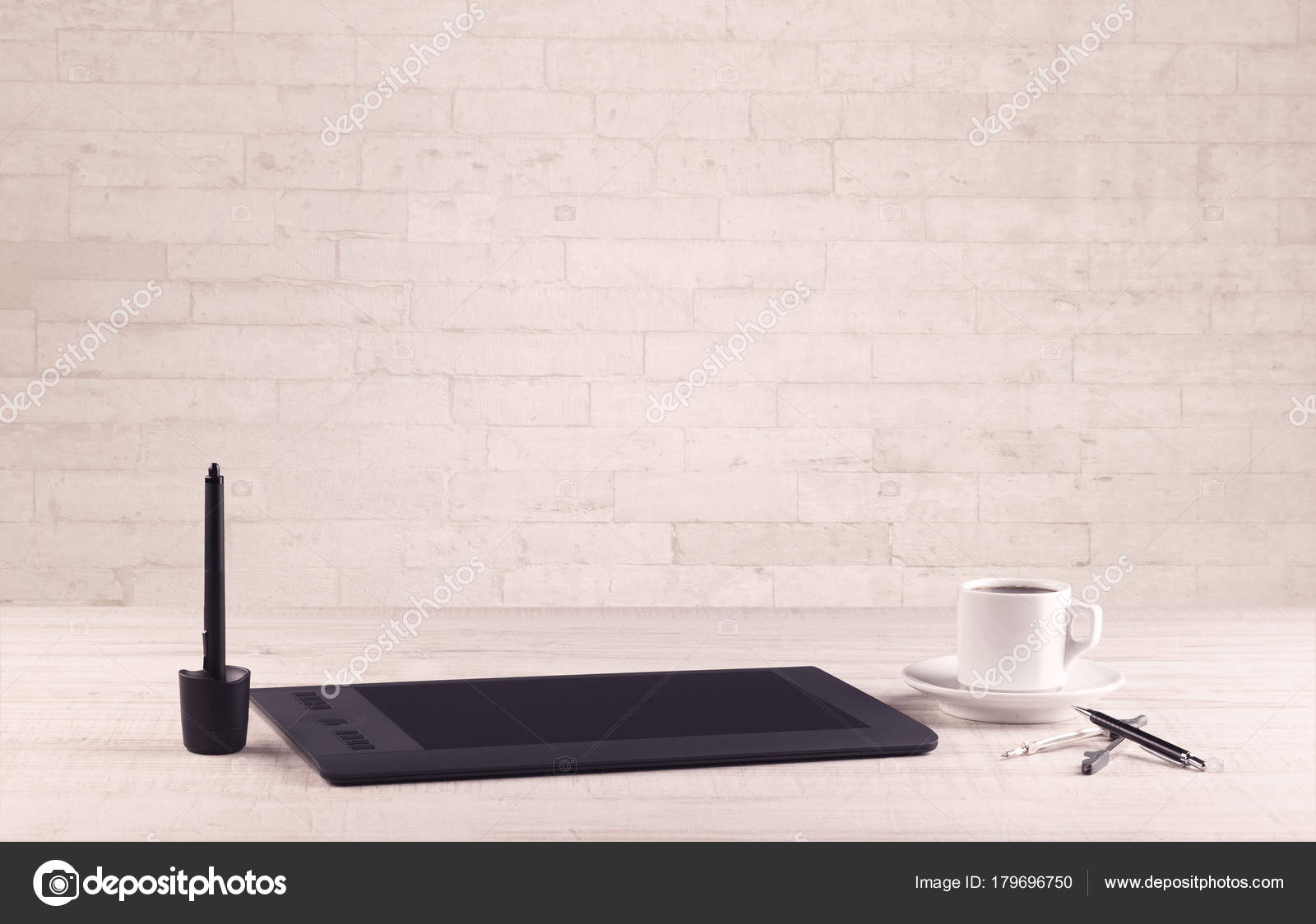 Office Desk Closeup With White Brick Wall Stock Photo
