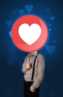 Kalp işareti tutan işadamı