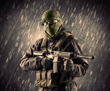 Armed terrorist man with mask on rainy background clipart
