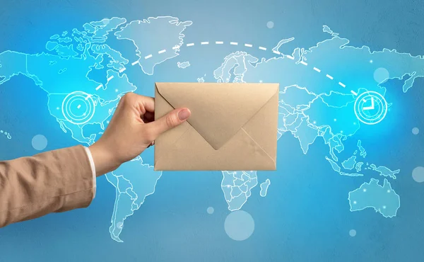 Hand holding envelope with global concept — Stock Photo, Image