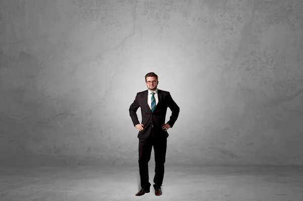 Alone businessman standing in a dark room — Stock Photo, Image