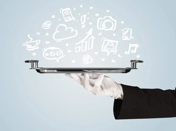 Waiter holding tray with media icons — Stock Photo, Image