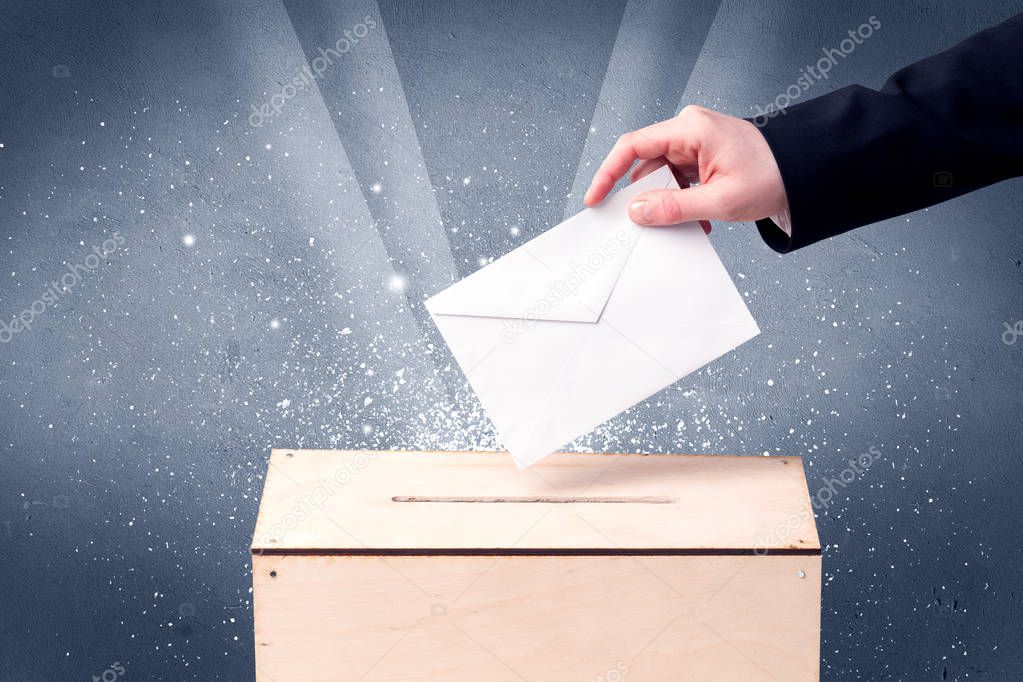 Ballot box with person casting vote