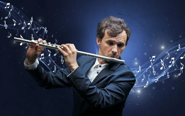 Lonely composer playing on flute — Stock Photo, Image