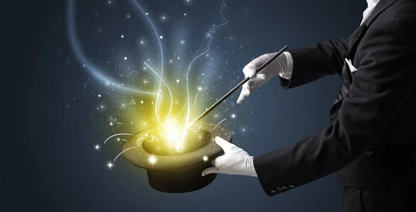 Magician hand conjure miracle from cylinder — Stock Photo, Image