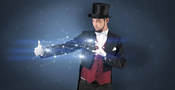 Kouzelník s geometrickou připojením na ruce — Stock fotografie