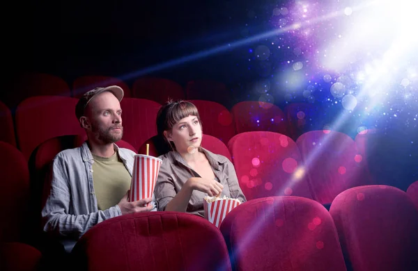 Romantic couple sitting at spectacle — Stock Photo, Image