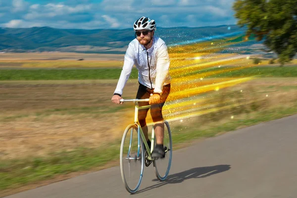 Young riding bicycle in nature — Stock Photo, Image