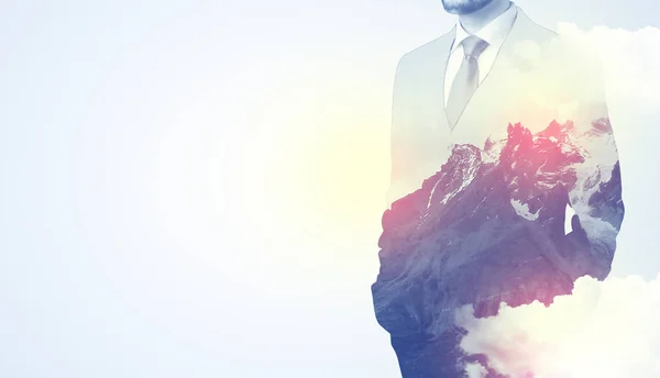 Businessman standing with mountain graphic — Stock Photo, Image