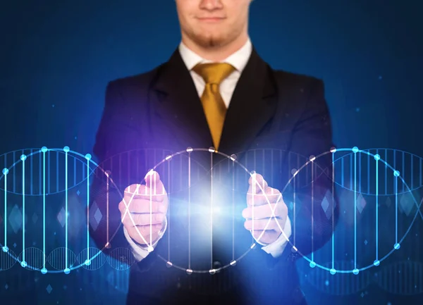 Businessman holding DNA