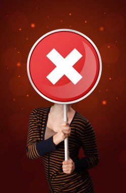 Tutan kadın x işareti