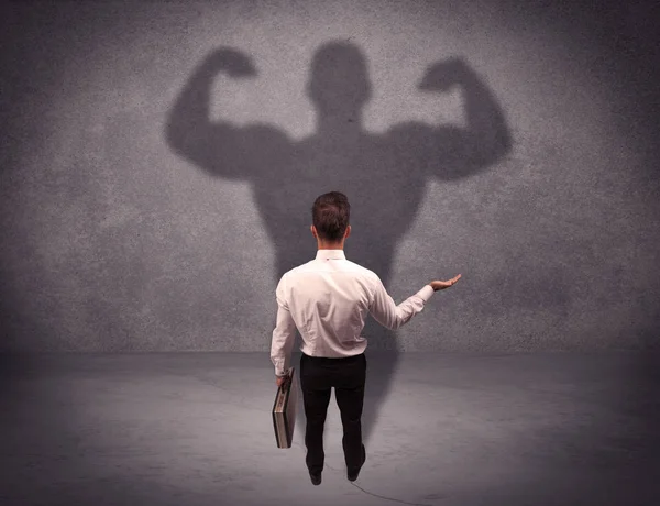 Successful businessman with strong shadow — Stock Photo, Image