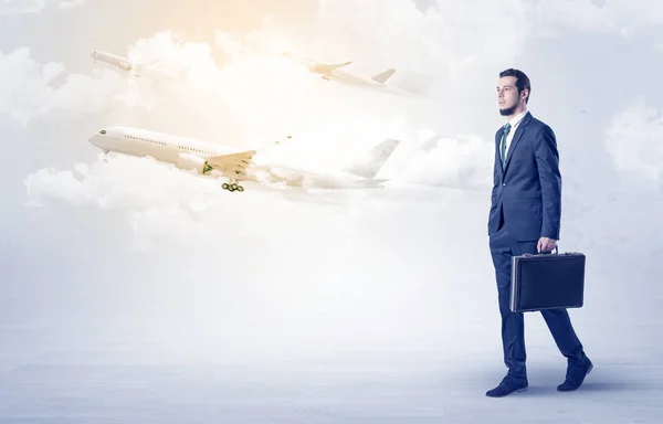 Businessman going somewhere with airplane — Stock Photo, Image