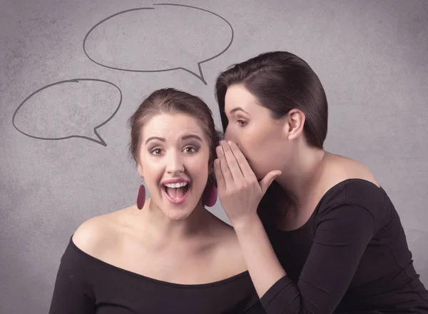 Girl telling secret things to her girlfriend — Stock Photo, Image