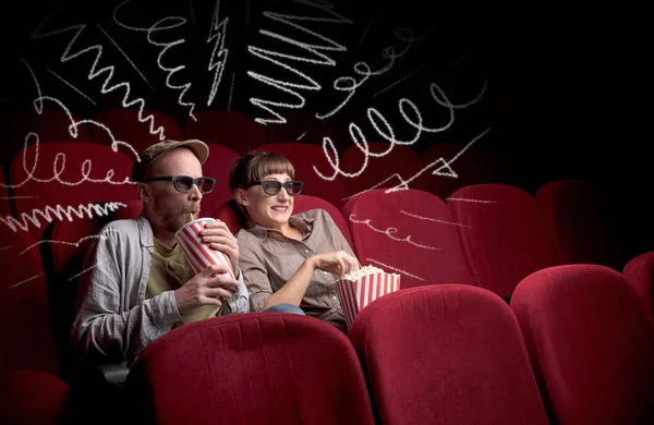 Cute couple in cinema watching movie — Stock Photo, Image