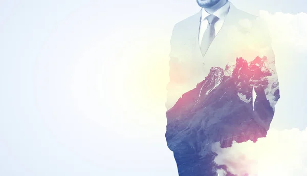 Businessman standing with mountain graphic — Stock Photo, Image