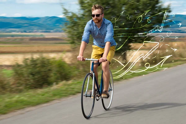 Young cyclist in with meadow background — Stock Photo, Image