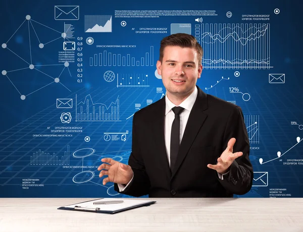 Businessman sitting at a desk — Stock Photo, Image