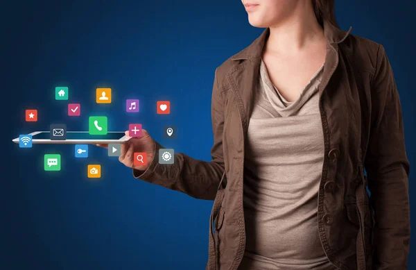 Woman holding tablet with multimedia graphics — Stock Photo, Image