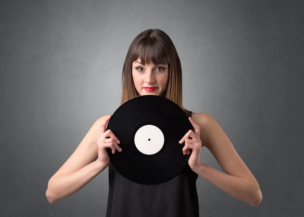 Lady holding vinyl record