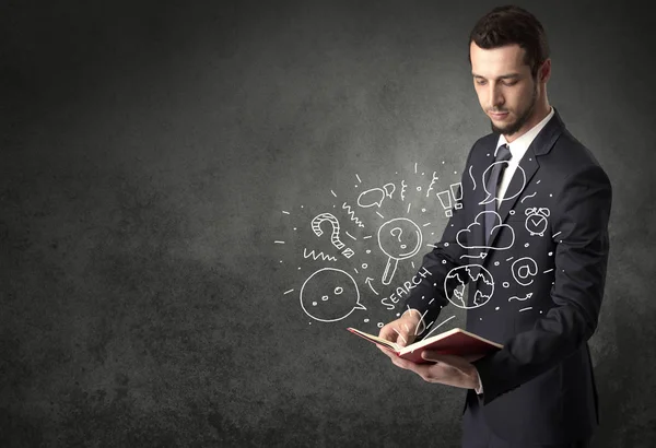 Hombre de negocios sosteniendo un libro. — Foto de Stock