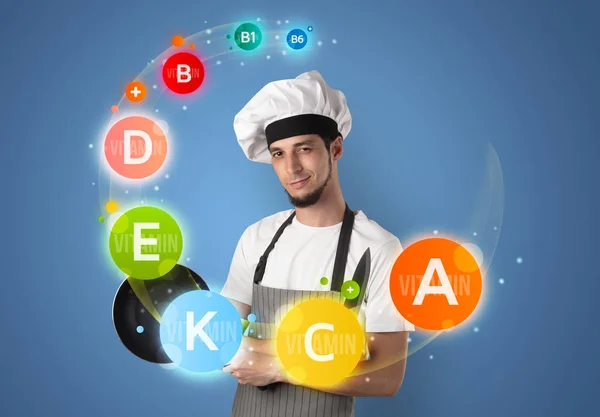 Handsome cook with vitamin concept — Stock Photo, Image