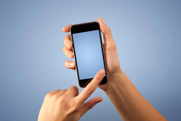 Female hand holding smartphone — Stock Photo, Image