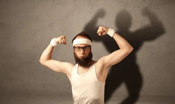 Skinny man with musculous shadow — Stock Photo, Image