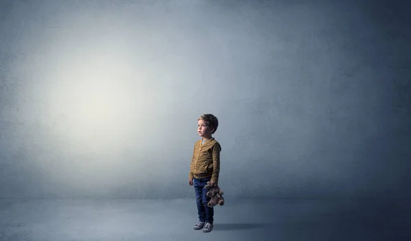 Little waggish kid in an empty room — Stock Photo, Image