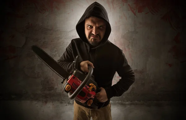 Armed assassin in an empty bloody room concept — Stock Photo, Image