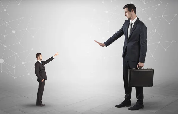 Small man aiming at a big man with network concept — Stock Photo, Image