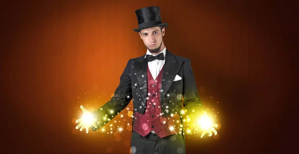 Illusionist holding superpower on his hand — Stock Photo, Image