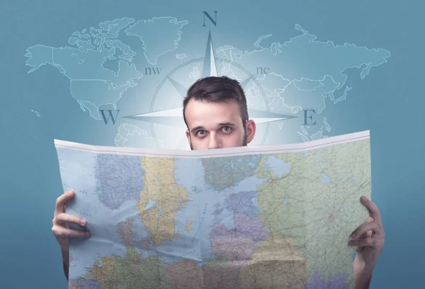 Young man holding map — Stock Photo, Image