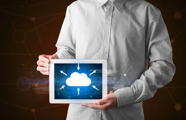 Businessman holding tablet with cloud icon