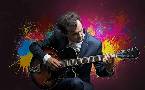 Composer with splotch and his guitar Stock Photo