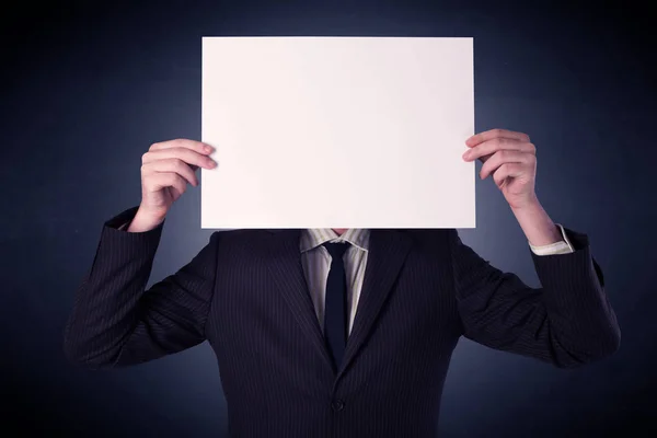 Businessman holding blank paper Stock Picture