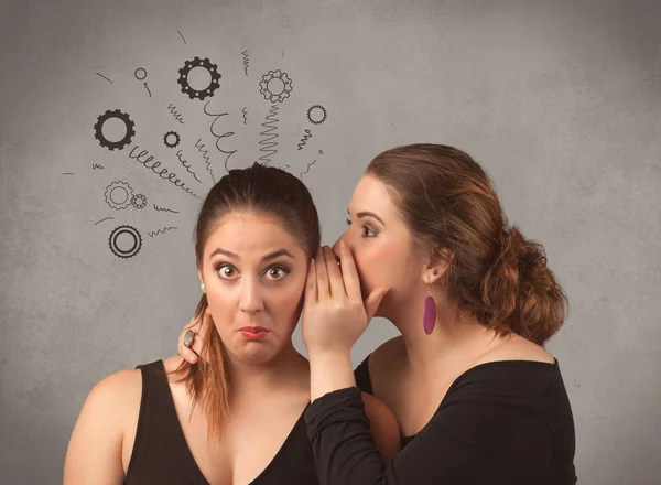 Girl telling secret things to her girlfriend — Stock Photo, Image