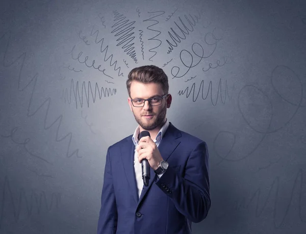 Businessman holding microphone — Stock Photo, Image