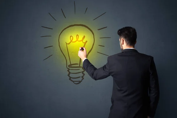 Businessman with lightbulb — Stock Photo, Image