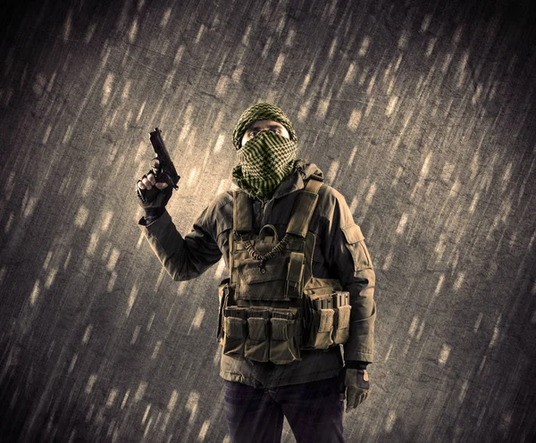 Armed terrorist man with mask on rainy background — Stock Photo, Image